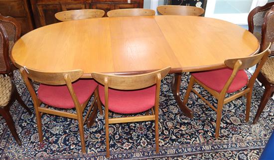 A mid century teak extending dining table and six chairs 206cm extended (one spare leaf)